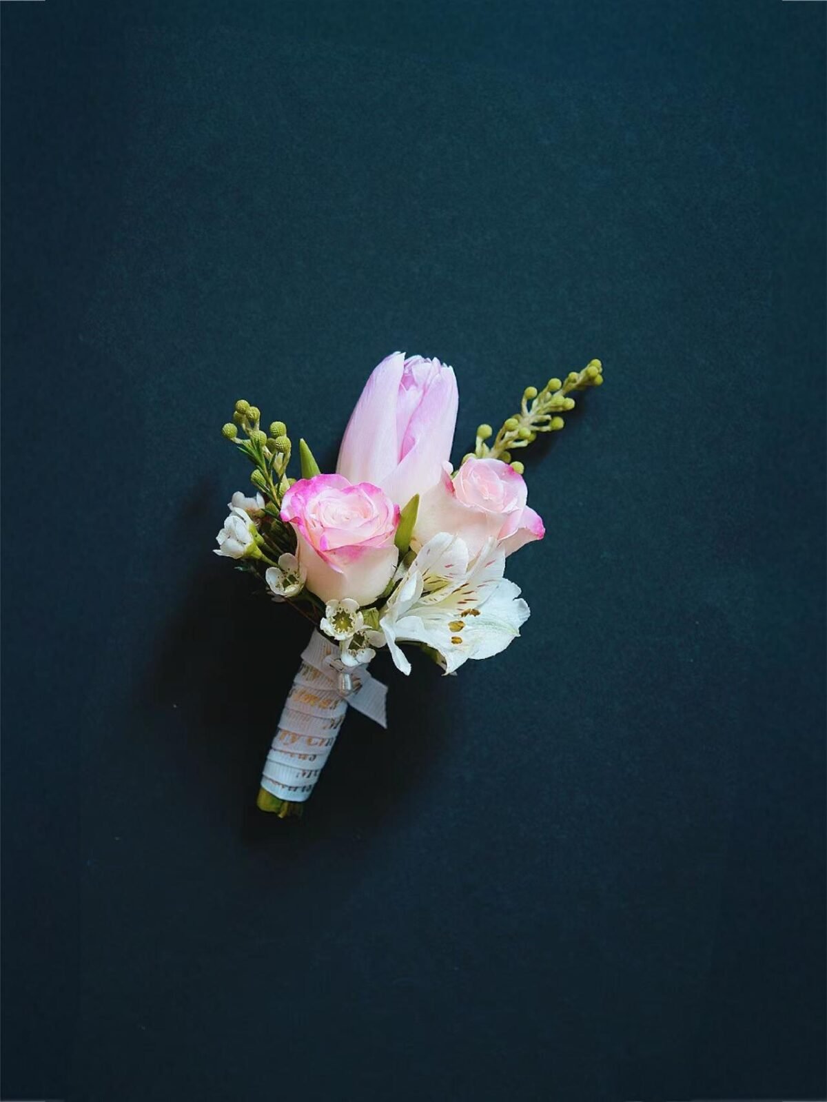 Pink Roses And Tulips Boutonniere